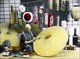 Japan: An umbrella maker painting a parasol, c.1900-1910